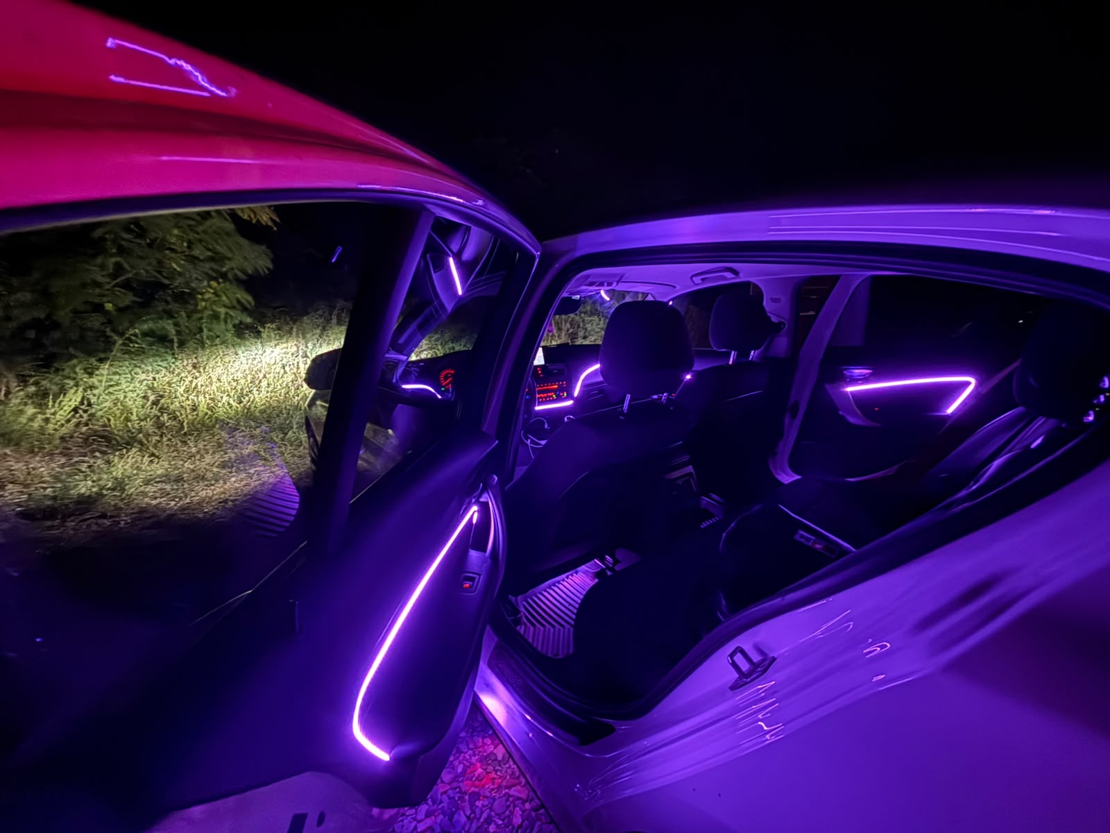 Purple ambient lighting in a car seen from the side